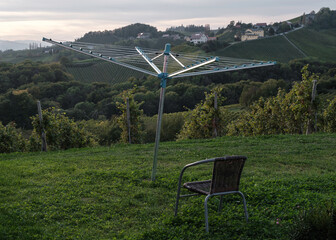 a chair and a clothes rack like an antenna in the garden