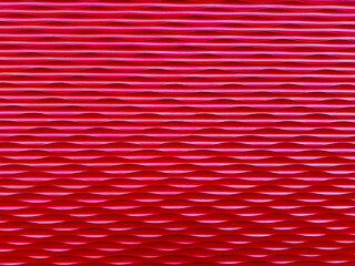 Background of red textured plastic panel