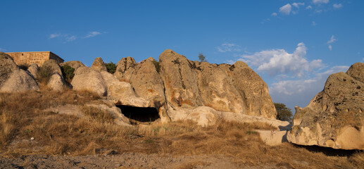 Fototapeta premium Historical Forty Stairs Rock and Phrygian rock chambers by Lake Emre. Phrygian valley. Travel destinations in Turkey. Ihsaniye district, Afyonkarahisar city