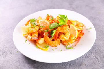 fried shrimp with lemon and parsley on plate