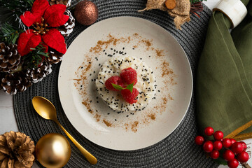 Delicious Thai sticky rice with fresh fruit on a table with Christmas decoration.