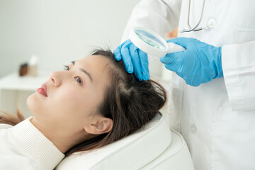 Specialist of hair recheck hair of Asian woman, damaged hair, hair loss, thinning problem, vitamin...