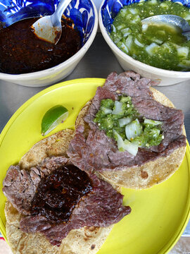 Beef Tacos are seen next to spicy chilli sauces at the Taqueria El Califa de Leon stand in Mexico City, Mexico.