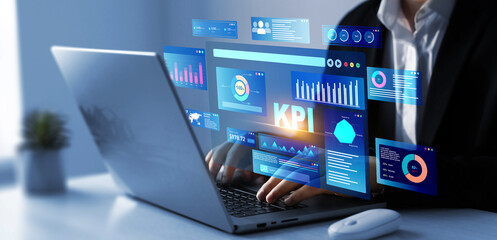 Businessman using KPI dashboard.Management data System KPI connected in database for follow...