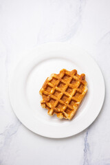 Belgian waffles on white plate