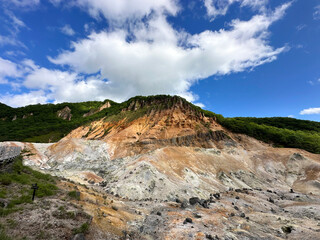 Noboribetsu Hell Valley with boiling springs area in summer Hokkaido, Japan.