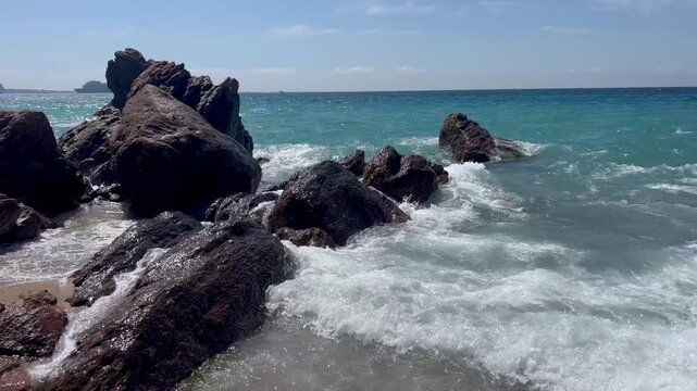 View of the Bay of Cannes with red rocks of Cap Esterel, Cannes, Cte d Azur, France. Cannes beach - France, Provence-Alpes-Cote d'Azur, View from beach to yachts in the evening. View of sea