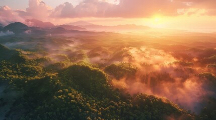 Fototapeta premium A breathtaking aerial view of misty mountains and valleys during sunrise.