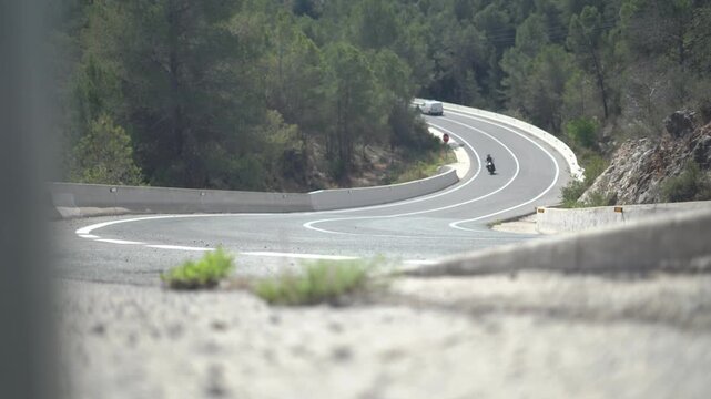 Motorcycle rider in a mountain road