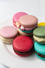 Colorful macaroons on a white background. Selective focus.