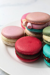 Colorful macaroons on a white background. Selective focus.