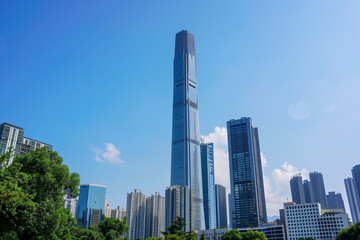 Naklejka premium Skyscrapers Viewed from Below with Blue Sky and White Clouds
