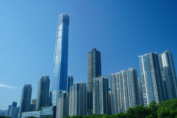 Naklejka premium Skyscrapers Viewed from Below with Blue Sky and White Clouds
