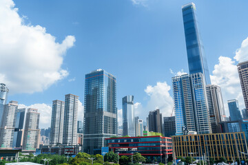 Obraz premium Skyscrapers Viewed from Below with Blue Sky and White Clouds
