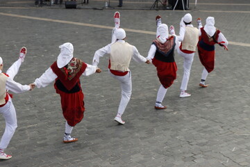Folk dancers from the Basque Country during a performance in an outdoor festival in Bilbao, Spain