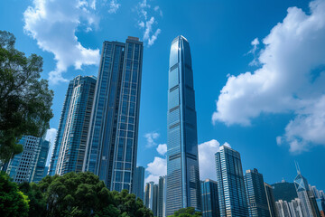 Skyscrapers Viewed from Below with Blue Sky and White Clouds