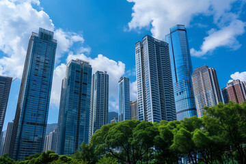 Skyscrapers Viewed from Below with Blue Sky and White Clouds