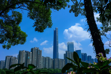 Fototapeta premium Skyscrapers Viewed from Below with Blue Sky and White Clouds
