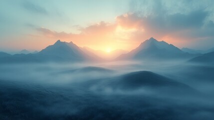 Obraz premium Sun shining through mountain peaks over foggy landscape