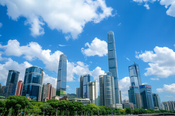 Naklejka premium Skyscrapers Viewed from Below with Blue Sky and White Clouds