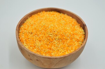 Breadcrumbs in wooden bowl isolated on white