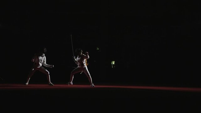 Fight Of Fencers Sportswomen In Fencing Track, Female Silhouettes With Rapiers, Slow Motion