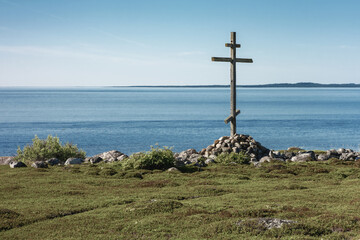 Old wooden cross on the shore of the White Sea.