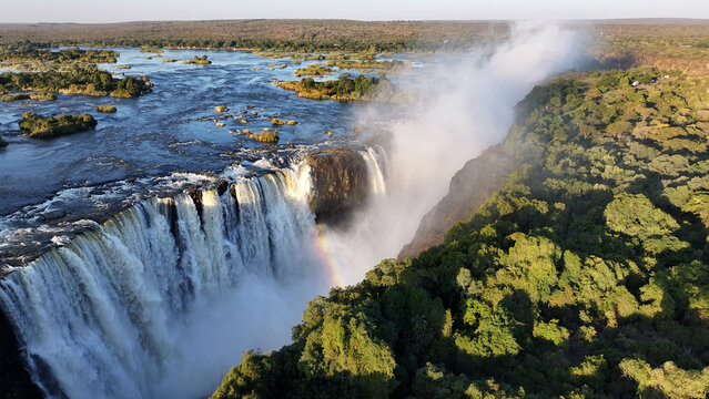 Famous Water Falls At Victoria Falls In Matabeleland North Zimbabwe. Giant Waterfalls. Nature Landscape. Victoria Falls At Matabeleland North Zimbabwe. Zambezi River. Travel Scenery.