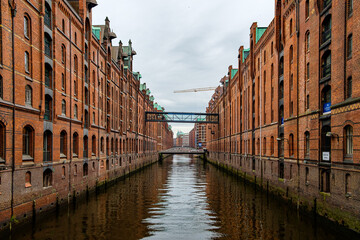 Naklejka premium European city street on the river bank and the clear sky above in the Northern Germany. 