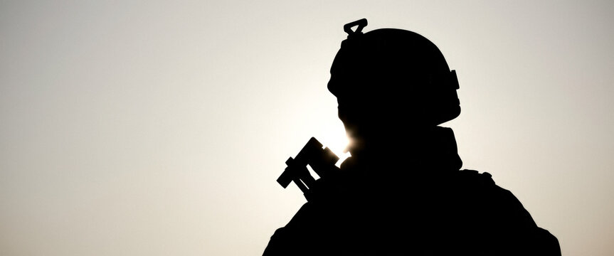 Silhouette of a Soldier Standing in the Light