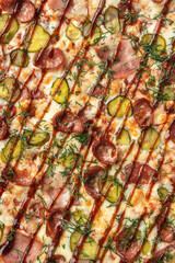 the macro composition of pizza for the menu. fresh ingredients are cheese, ham and tomatoes.