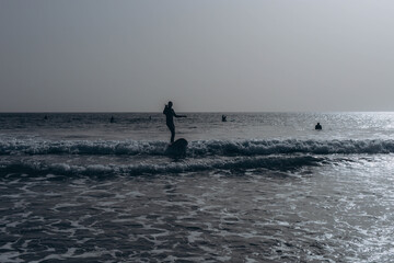  young guy surfers going for surfing in the ocean.