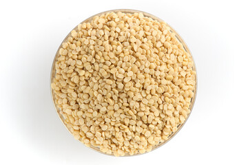 Urad Dal or Urad Bean or Black Gram (Vigna Mungo) Dry Split Urad Beans Polished in a bowl on white background top shot, tabletop shot of urad dal in a bowl