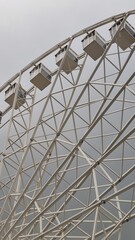 White ferris wheel in cloudy weather