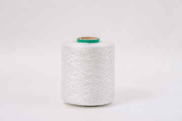  A close-up of a single large spool of white fiberglass yarn with a blue core, isolated against a plain white background.