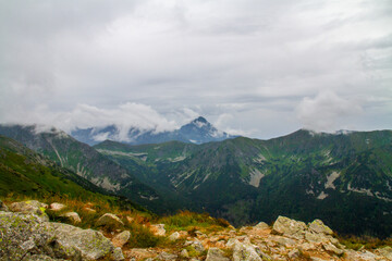 Beautiful mountain landscape with clouds and fog. 