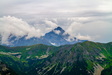 Beautiful mountain landscape with clouds and fog. 