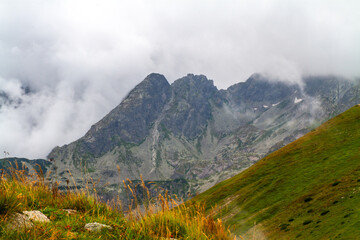 Beautiful mountain landscape with clouds and fog. 