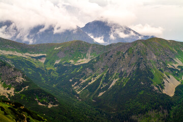 Beautiful mountain landscape with clouds and fog. 