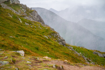 Beautiful mountain landscape with clouds and fog. 