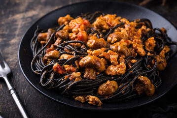 Halloween dish black pasta with bolognese