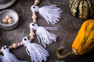 DIY craft Halloween garland in shape of ghost.