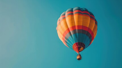 Obraz premium A colorful hot air balloon soaring in the sky, symbolizing freedom, adventure, and the heights of success