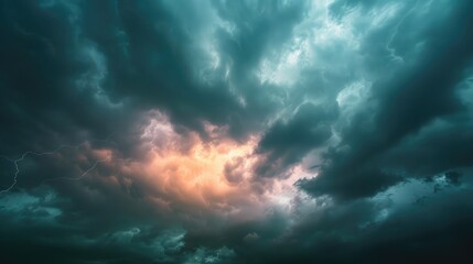 Obraz premium A dramatic stormy sky background with dark clouds and flashes of lightning, evoking power and intensity