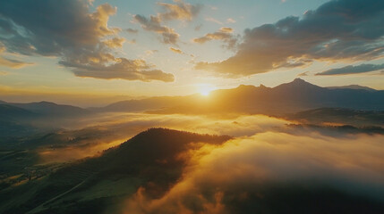 Obraz premium Golden sunlight paints vibrant hues across a breathtaking mountain cloudscape