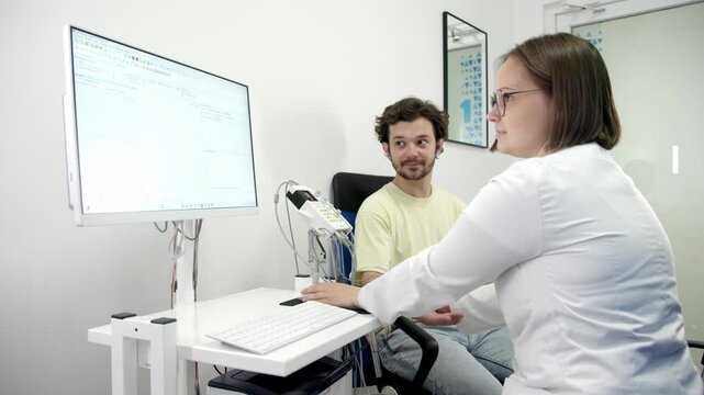 The patient undergoes an electromyography (EMG) test to assess nerve activity. Detects nerve and muscle dysfunctions. Perfect for showcasing advanced medical technologies