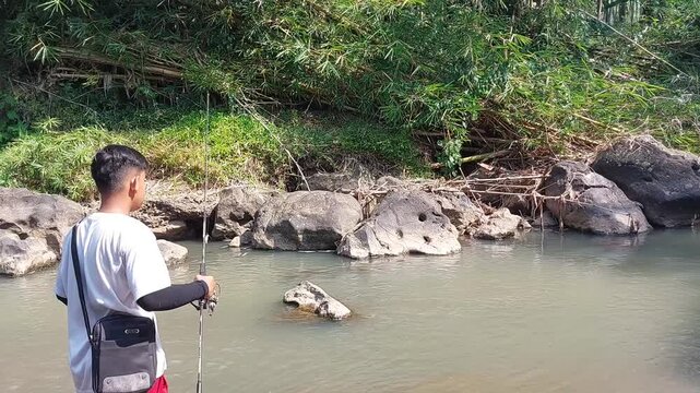An angler who is fishing with a casting technique