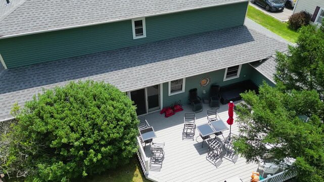 View from a drone of a newly renovated composite deck with furniture on it.