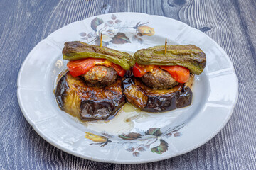 Traditional delicious Turkish food; Kofte kebab wrapped in eggplant (Turkish name; Islim - islim kebabi or kurdan kebabi)