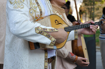 Musicians wearing one of the traditional folk costume from Republic of Kazakhstan